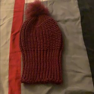 Burgundy hat with puff ball